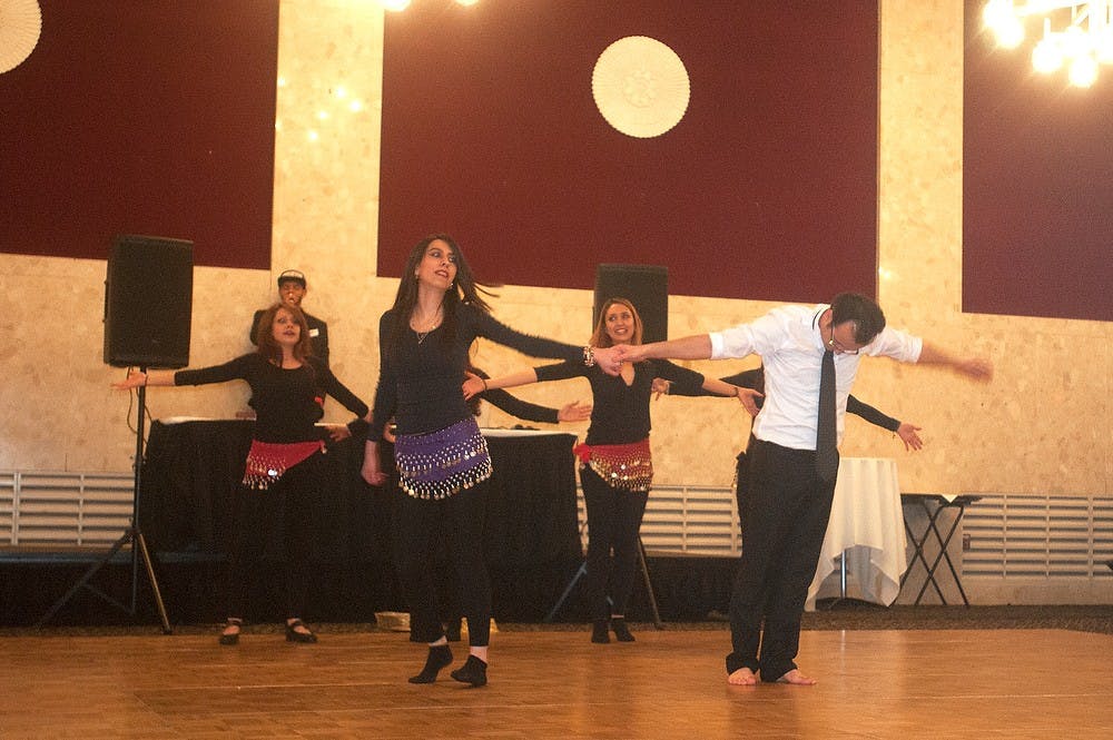 <p>Members of the Persian Student Association perform a traditional dance March 20, 2015, at the MSU Union during the Persian Student Association's celebration of the Persian New year. Kennedy Thatch/The State News</p>