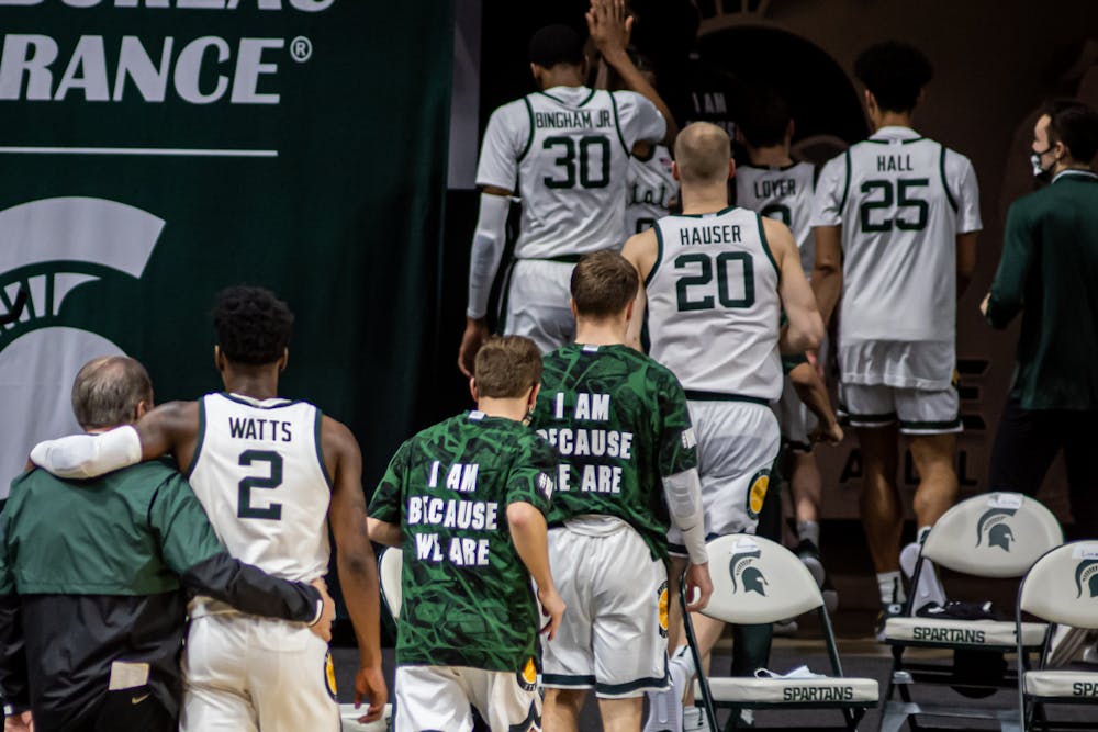 <p>Victory formation: sophomore guard Rocket Watts and Head Coach Tom Izzo walk back to the locker room with their arms around each other after the Spartans&#x27; win against Penn State on Feb. 9, 2021.</p>