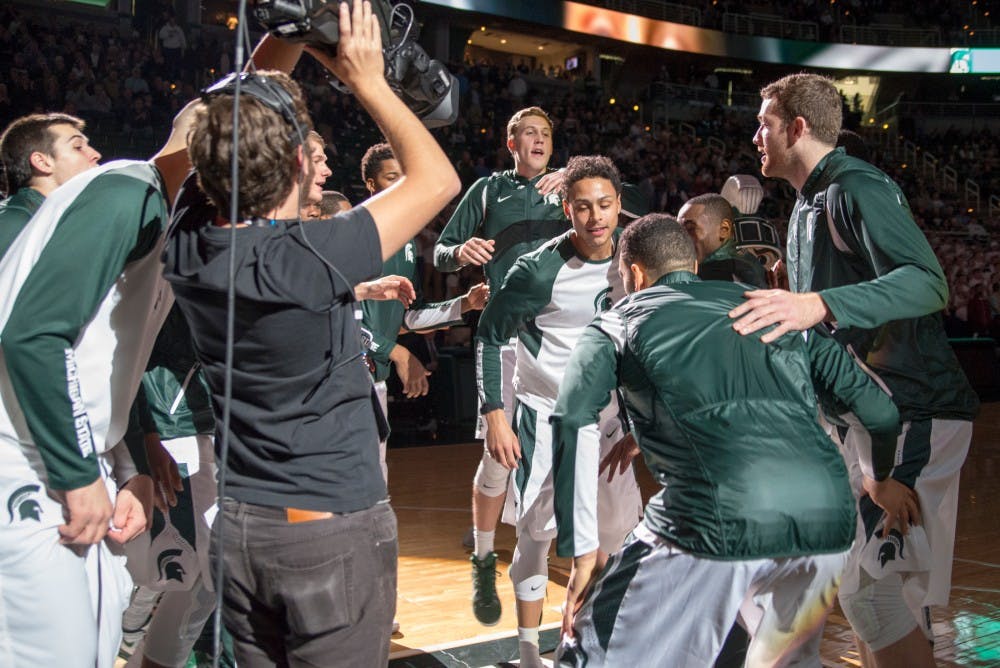Senior guard Bryn Forbes runs into the huddle while the starting lineup is being announced during the men's basketball game against Maryland Eastern Shore on Dec. 9, 2015 at the Breslin Center. The Spartans defeated the Hawks, 78-35.