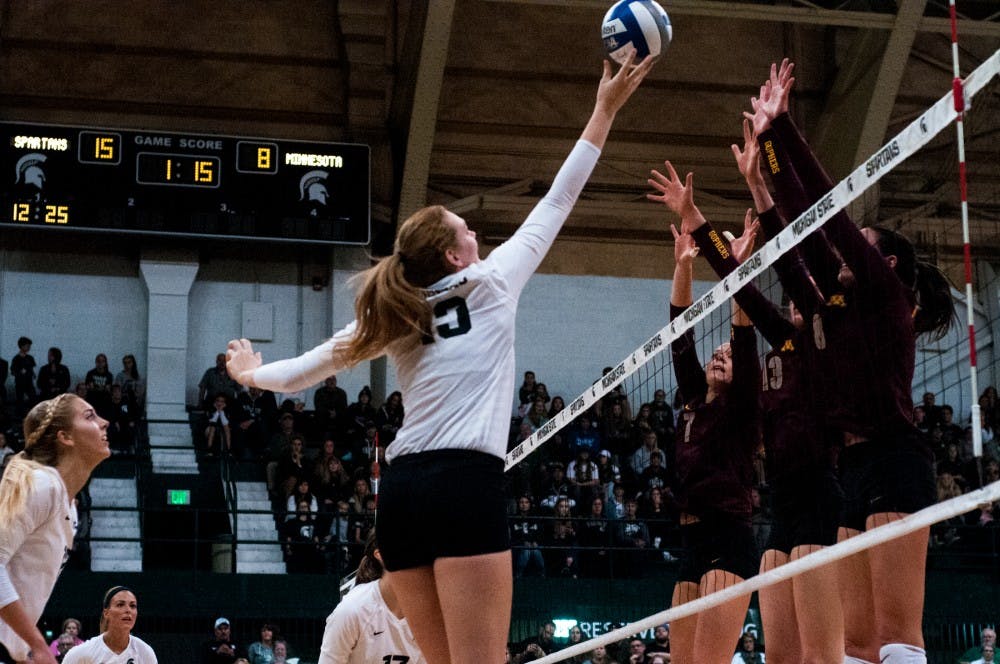 Junior outside and right side hitter Brooke Kranda (13) hits the ball during the game against Minnesota on Oct. 15, 2016 at Jenison Fieldhouse.  The Spartans defeated the Golden Gophers, 3-2.