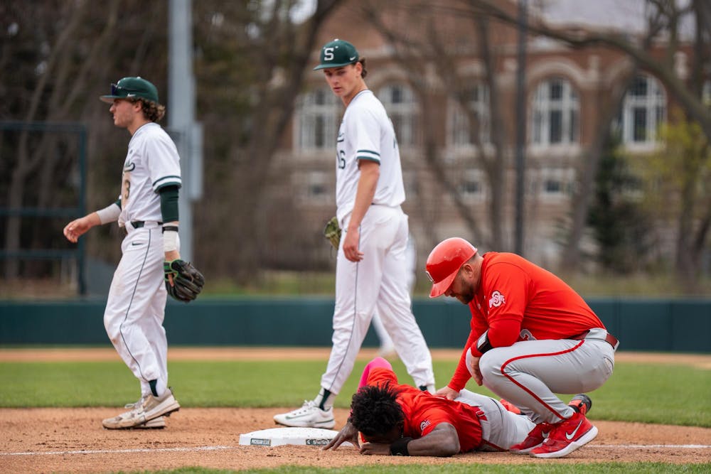 <p>Ohio State sophomore infielder Lee Ellis' (1) helmet flies off while sliding on a base at McLane Stadium on April 19, 2025. </p>