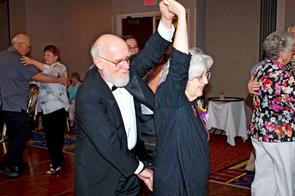 	<p>Steve Waltke and Tina Layman of Okemos travel across the dance floor Friday in a Marriott Hotel ballroom at 300 M.A.C Ave.  The sixth annual Senior Prom was held Friday to support the Ingham County <span class="caps">TRIAD</span>, a law enforcement and community partnership that works to promote quality of life for our elder population.</p>