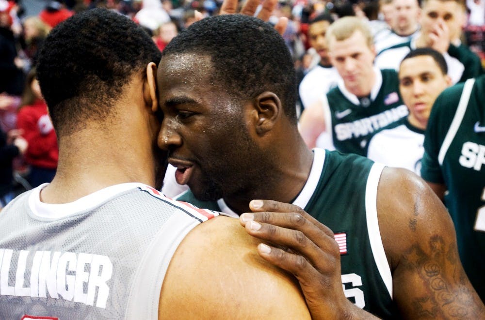 Senior forward Draymond Green hugs with Ohio State forward Jared Sullinger after the game Saturday night at Schottenstein Center at Columbus, Ohio. Sullinger  scored 17 points for the Buckeyes, the best scoring player for the game. The Spartans defeated the Ohio State Buckeyes, 58-48. Justin Wan/The State News