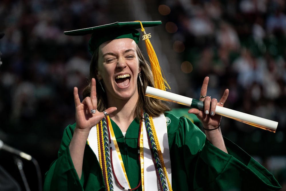Kayla Fowler celebrates after receiving her diploma at the Breslin Center on May 3, 2025.