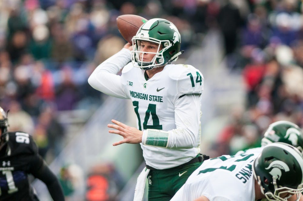 <p>Sophomore quarterback Brian Lewerke (14) throws the football during the game against Northwestern on Oct. 28, 2017, at Ryan Field. The Spartans fell to the Wildcats, 39-31, in 3OT.</p>