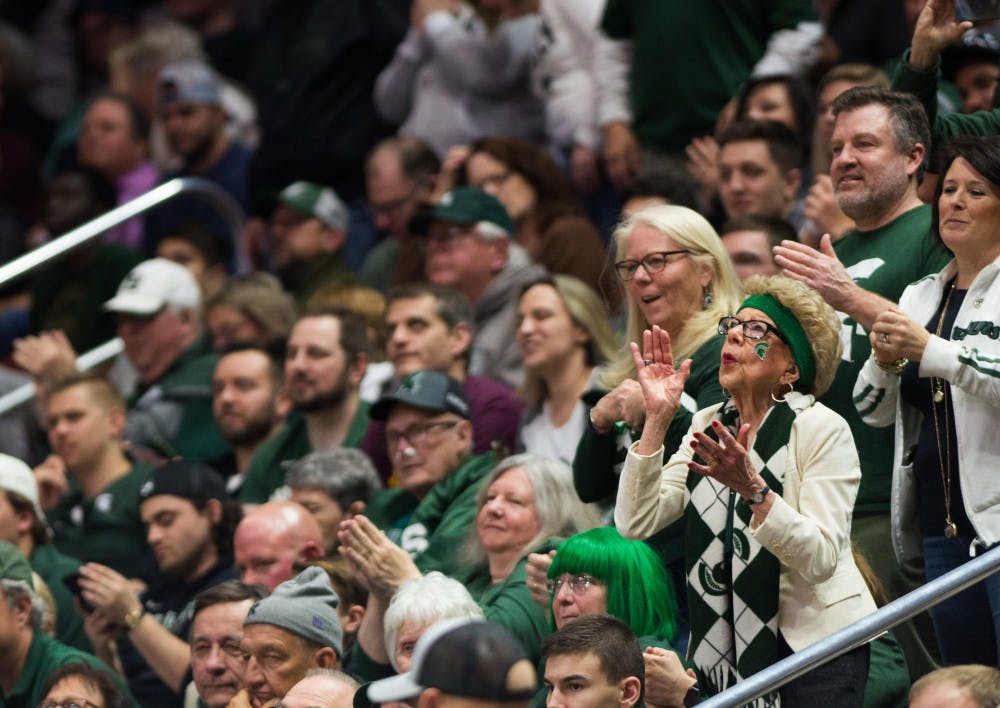 A Michigan State fan dances during the second round game of the NCAA tournament against Minnesota at Wells Fargo Arena March 23, 2019. The Spartans defeated the Gophers, 70-50.