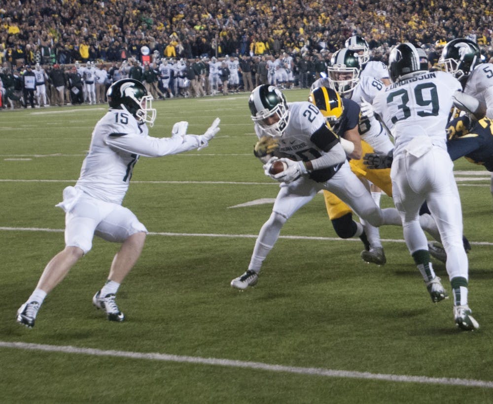 <p>Former redshirt freshman defensive back Jalen Watts-Jackson runs the ball for the game winning touchdown during the game against Michigan on Oct. 17, 2015 at Michigan Stadium. The Spartans defeated the Wolverines, 27-23.</p>