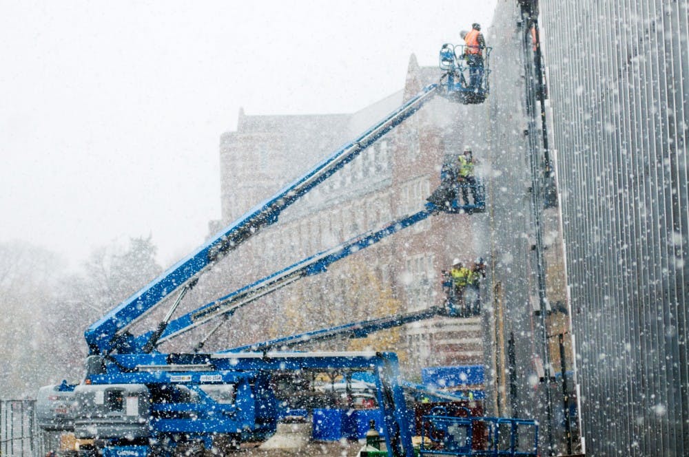 Workers operate on the exterior of the future site of Eli and Edythe Broad Art Museum Thursday afternoon. Scheduled to be dedicated by April 2012, the $45 million project will replace the existing Kresge Art Museum. Justin Wan/The State News