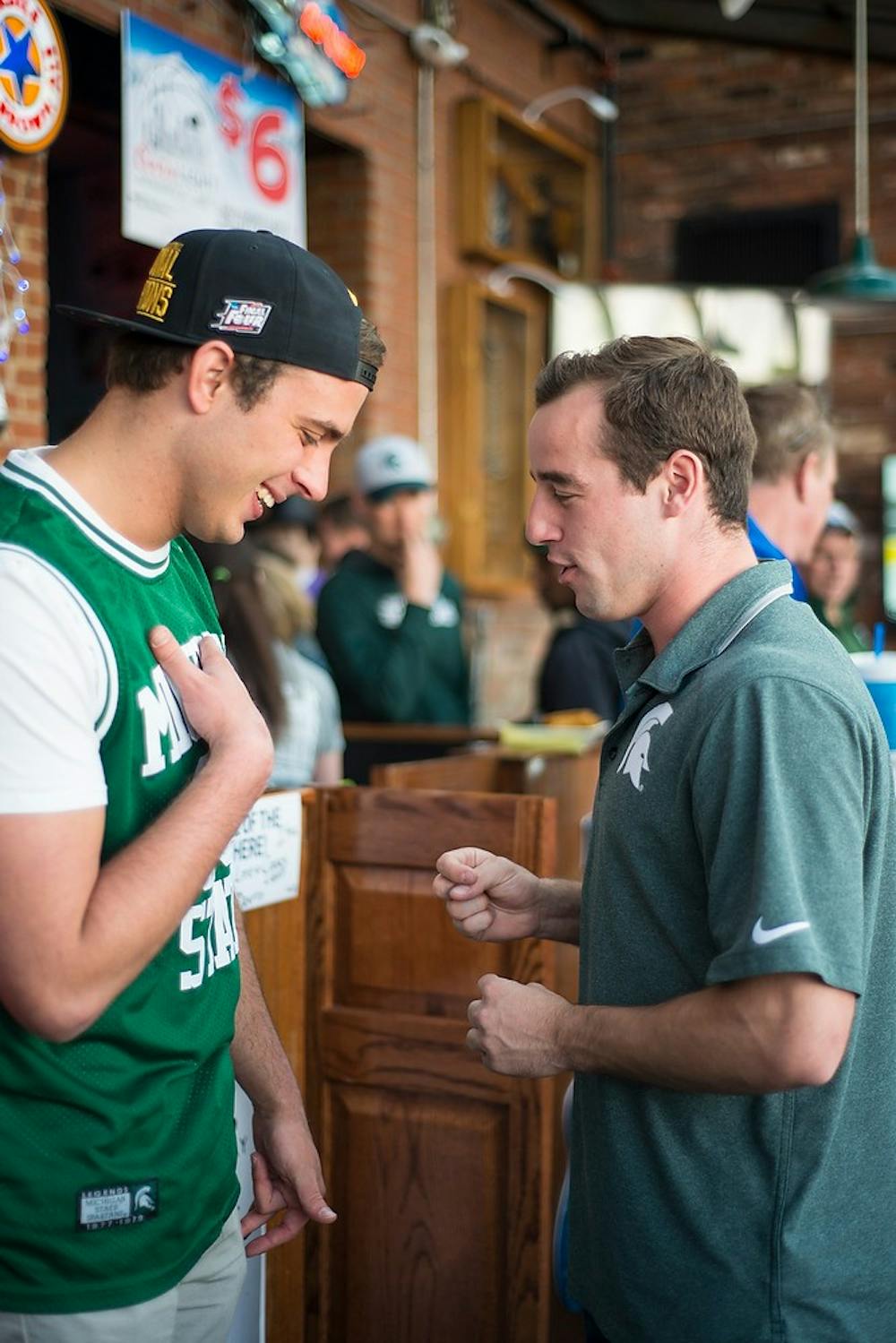 <p>MSU environmental studies & sustainability junior Dawson Laabs and MSU finance junior Brett MacDonald relax and talk April 4, 2015, before the semi-final game of the NCAA Tournament in the Final Four round at Slippery Noodle Inn  in Indianapolis, Indiana. The Slippery Noodle Inn is Indiana's oldest bar and welcomes spartans. Hannah Levy/The State News</p>