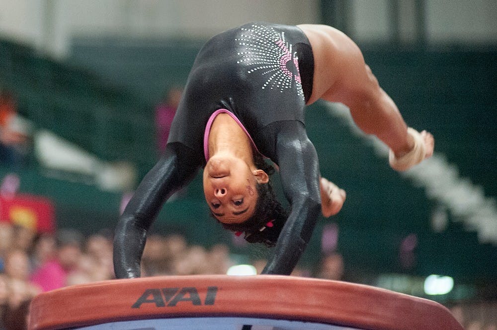 	<p>Freshman Nicola Deans competes in the vault event. Minnesota defeated <span class="caps">MSU</span>, 194.325 &#8211; 192.625, Friday, Feb. 1, 2013, at Jenison Field House. Justin Wan/The State News</p>