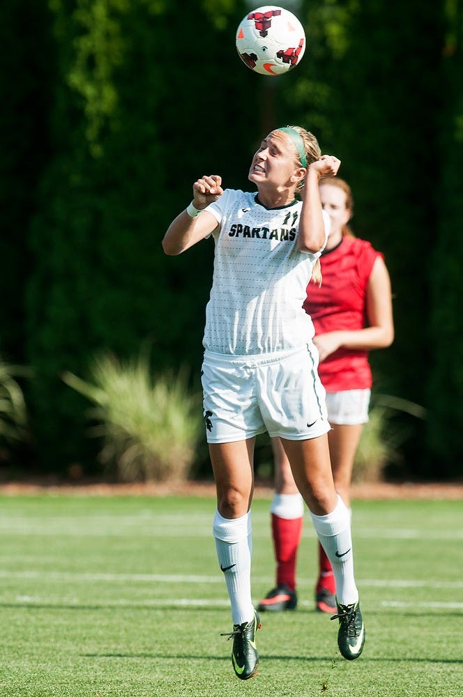 	<p>Sophomore forward Rachel Van Poppelen heads the ball during the game against San Diego State, Aug. 30, 2013, at DeMartin Soccer Stadium. The Spartans tied with the No. 21 ranked San Diego State Aztecs, 1-1. Danyelle Morrow/The State News</p>