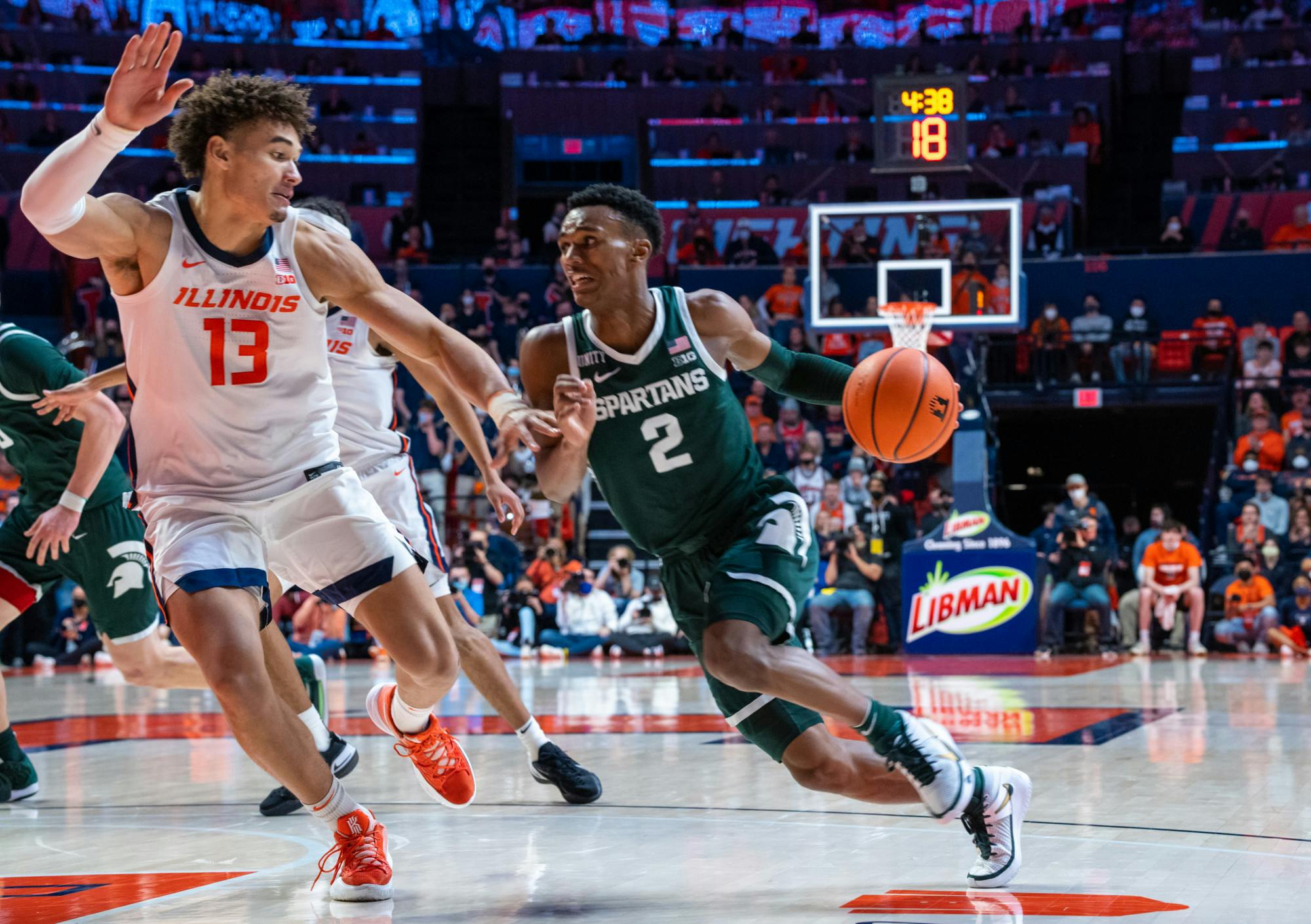 <p>Junior guard Tyson Walker (2) dribbles the ball towards the Illinois basket while being guarded by redshirt sophomore forward Benjamin Bosmans-Verdonk in the second half. The Spartans lost to the Fighting Illini in the final seconds, 56-55, at State Farm Center on Jan. 25, 2022. </p>