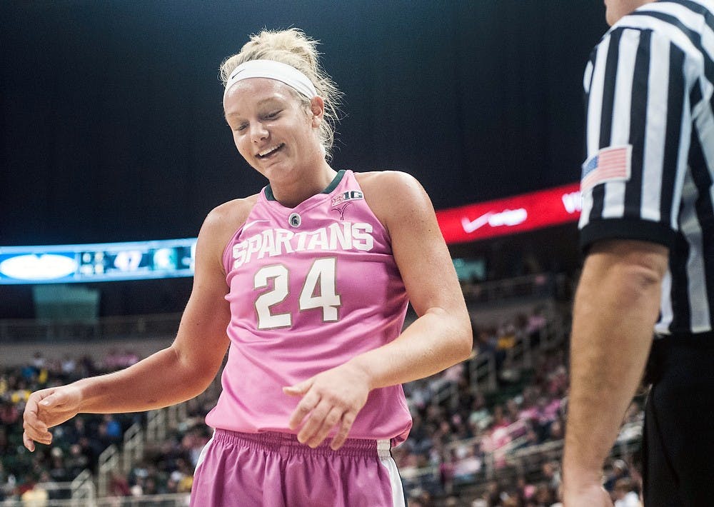 	<p>Senior forward Courtney Schiffauer smiles as she approaches the referee to inbound the ball Monday, Feb. 4, 2013, at Breslin Center. The Spartans defeated the Wolverines, 61&#8212;46, improving their record to 6-3 in the Big Ten. Adam Toolin/The State News</p>