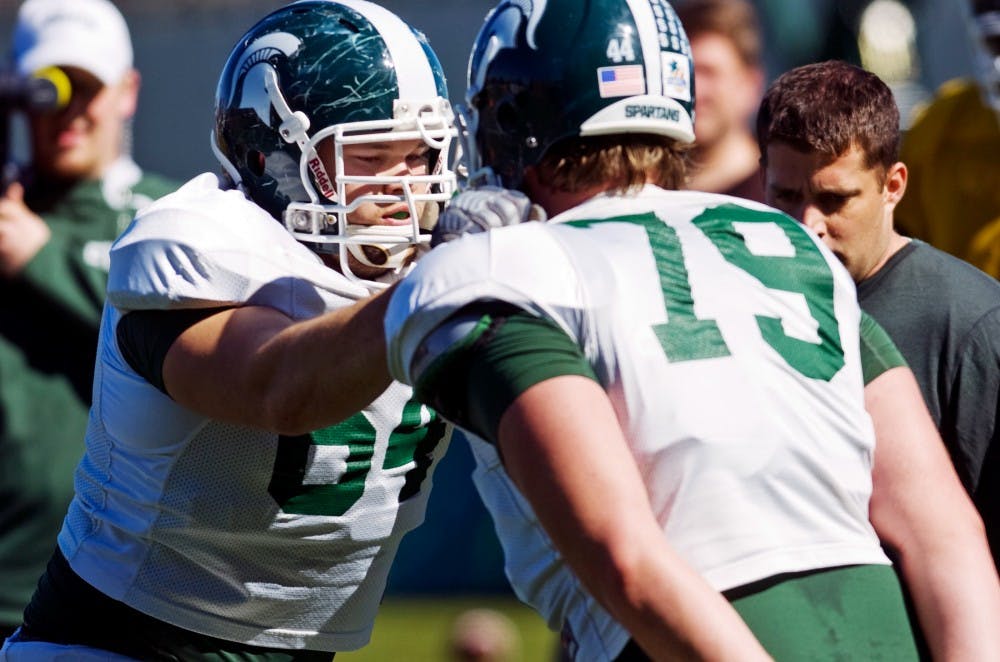 	<p>Then-center Blake Treadwell runs drills during 2011 spring football outside the Duffy Daugherty Football Buidling. Now a junior, Treadwell made the switch to left guard for the 2012 season. </p>