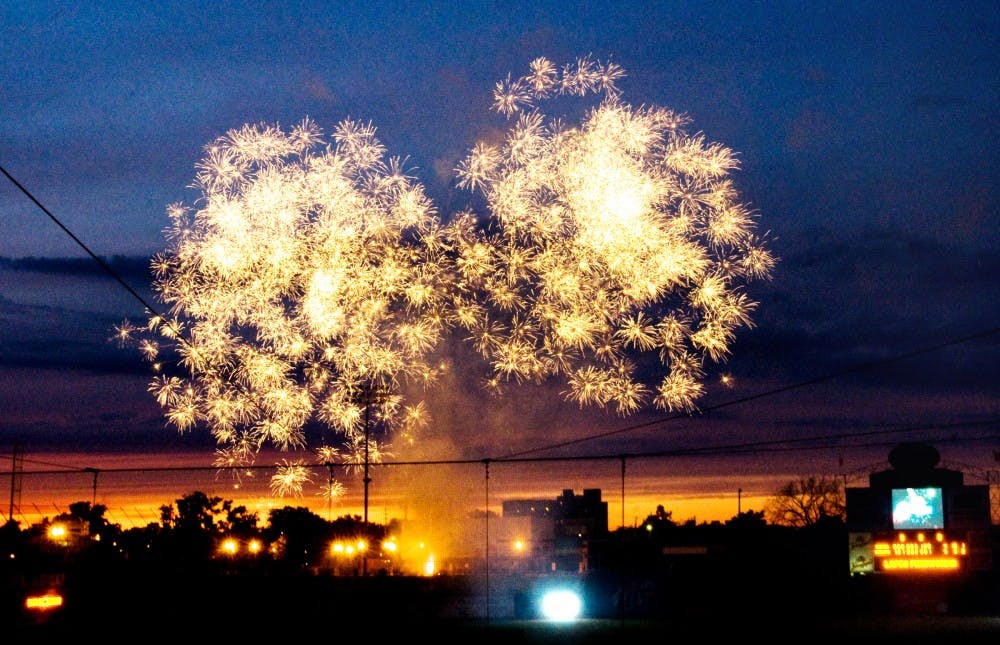 	<p>A firework display shimmers and shines above Cooley Law School Stadium Sunday night after the Lansing Lugnuts defeated Lake County 5-4. The fireworks were presented by East Lansing residents Marc and Branda Russell of Night Magic Displays. </p>