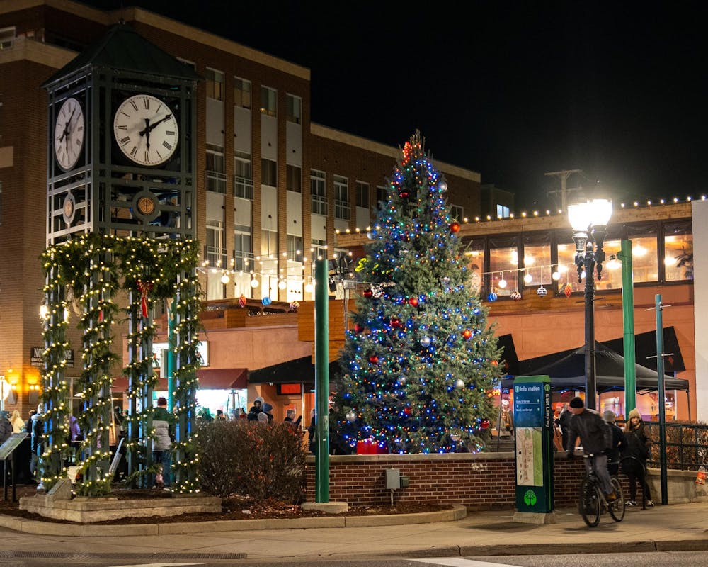 <p>The East Lansing Christmas tree sits along side the Ann St. Plaza clock tower during the East Lansing Annual Tree Lighting in East Lansing, MI on Nov. 22, 2025.</p>