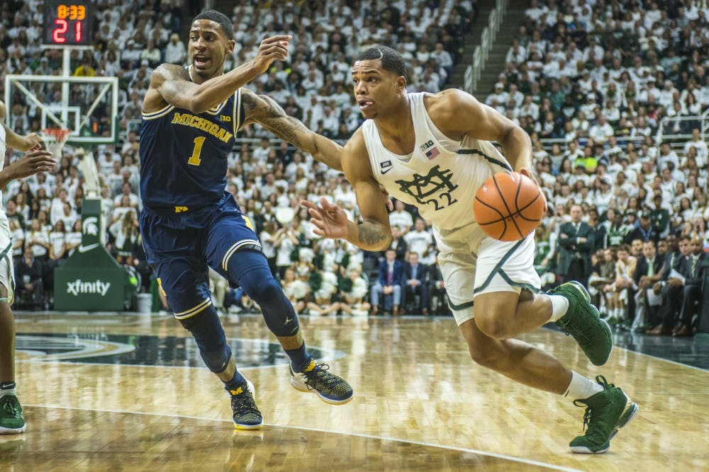 Sophomore guard Miles Bridges (22) drives the ball towards the net during the first half of the men's basketball game against Michigan on Jan. 13, 2018 at Breslin Center. The Spartan's led the first half, 37-34. (Nic Antaya | The State News)