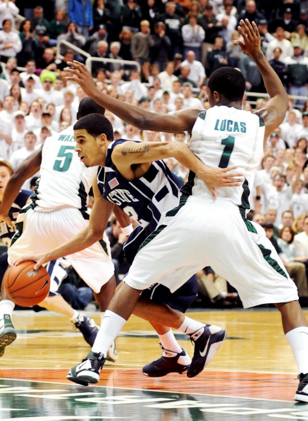 Penn State guard Talor Battle drives the ball past MSU sophomore guard Kalin Lucas. The Spartans lost for the second time in row at Breslin Center, 72-68, on Feb. 1. 2009. Josh Radtke/The State News