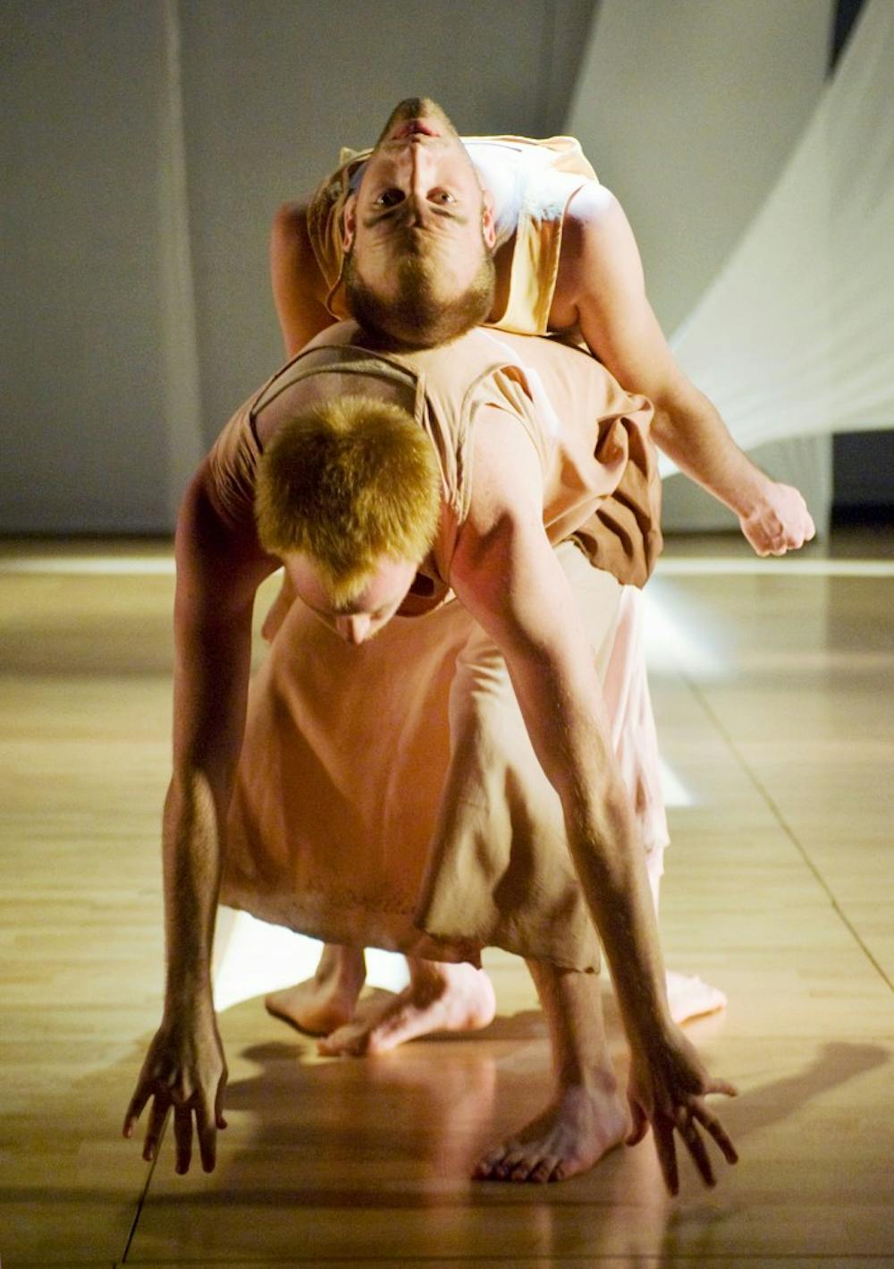 Interdisciplinary humanities junior Scott Stafford, above, and kinesiology sophomore Richard Price dance Sunday noon at RCAH Theatre at Snyder-Phillips Hall during rehearsal. In part choreographed by associate professor and director of dance Sherrie Barr, the four dances resolve in discovery and exploration on the journey to home. Justin Wan/The State News