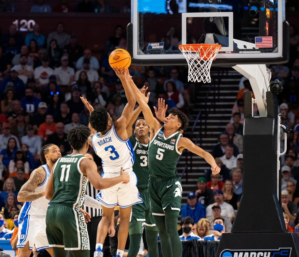 <p>Freshman guard Max Christie (5) attempts to block a shot by sophomore guard Jeremy Roach (5) during Duke&#x27;s victory over Michigan State on March 20, 2022.</p>