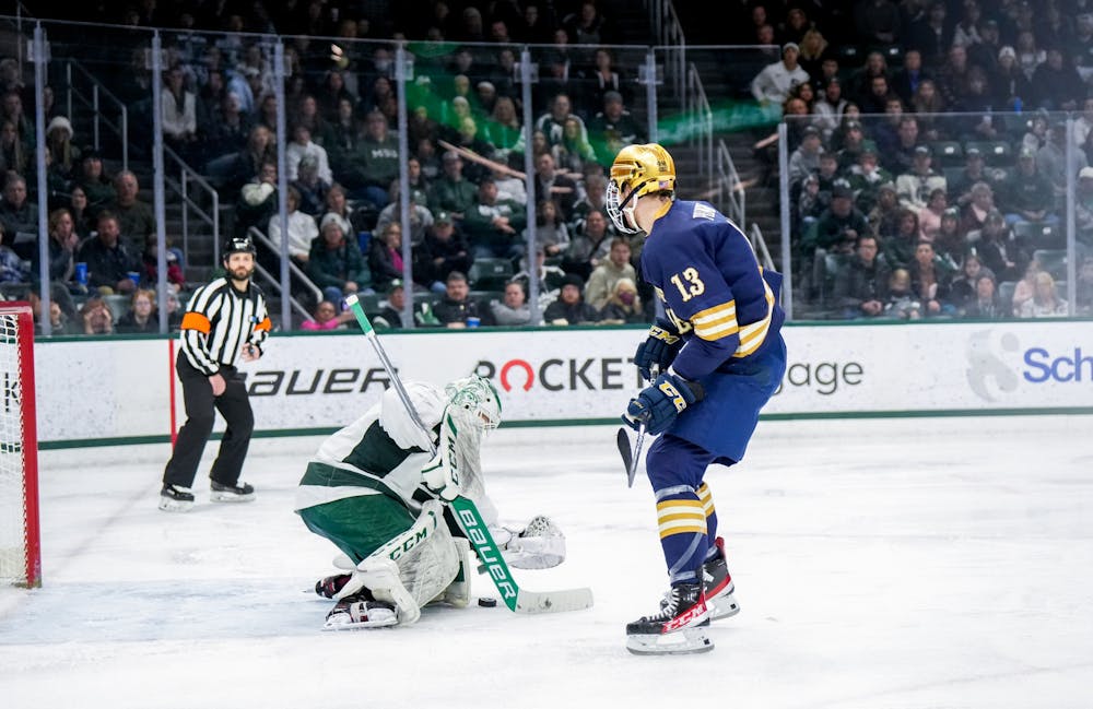 <p>Graduate student goalie Dylan St. Cyr (37) makes a save during a game against Notre Dame at Munn Ice Arena on Feb. 3, 2023. The Spartans defeated the Fighting Irish 3-0.</p>