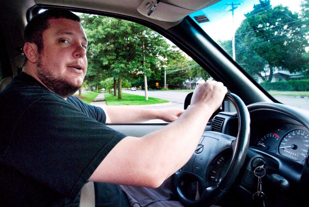 	<p>White Star Taxi driver Chris Fuller looks both ways before making a turn while driving East Lansing DJ Donnie Herronen to work at Rick&#8217;s American Cafe Wednesday evening. Fuller has been driving in East Lansing for about four years which he has spent building personal friendships with his many of his clients. </p>