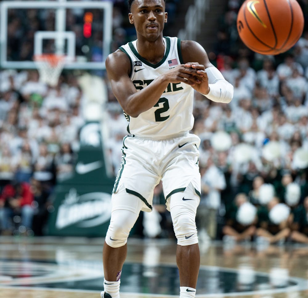 Senior guard Tyson Walker (2) passes the ball to his teammate during a game against Villanova at the Breslin Center on Nov. 18, 2022. The Spartans defeated the Wildcats 73-71. 