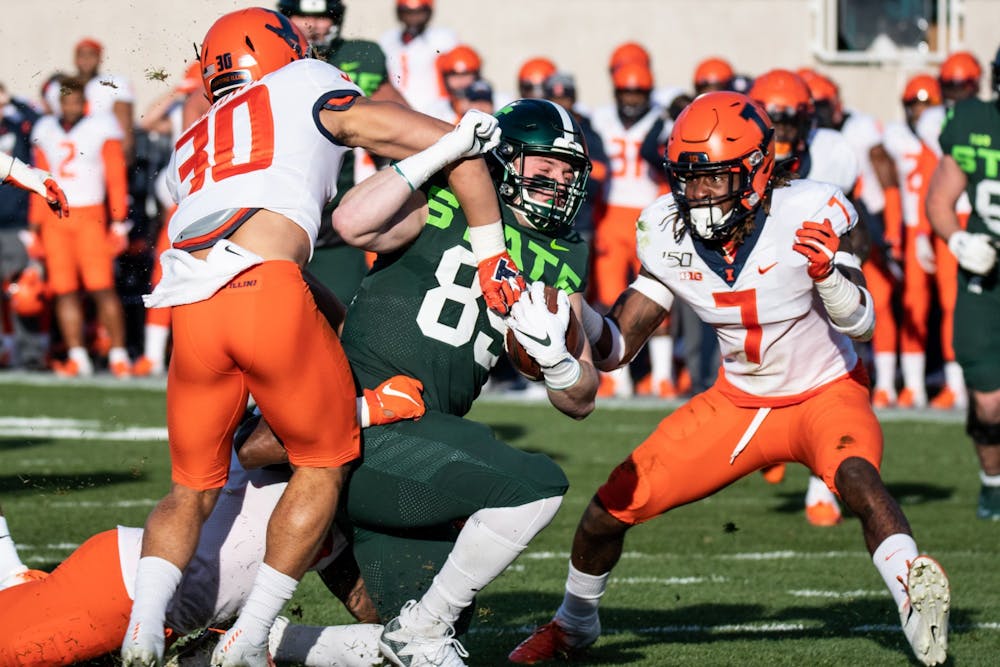 Junior tight end Matt Dotson (89) fights for yardage during the game against Illinois Nov. 9, 2019 at Spartan Stadium.