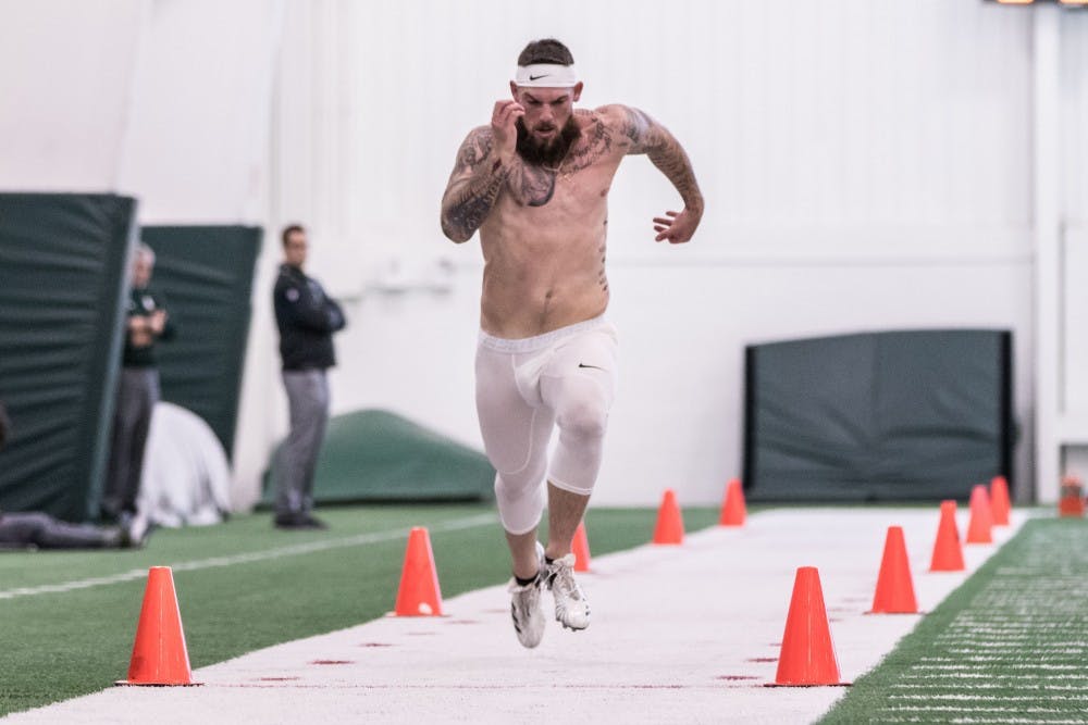 <p>Linebacker Chris Frey runs his 40 yard dash at MSU's pro day on March on March 23 at the Duffy Daugherty Football Building. MSU worked out five players at the pro day.</p>