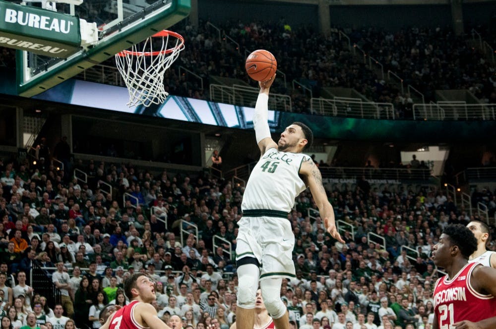 Senior guard Denzel Valentine shoots the ball during the second half of the game against Wisconsin on Feb.18, 2016 at Breslin Center. The Spartans defeated the Badgers, 69-54.