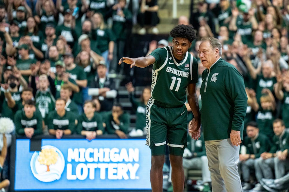 Michigan State Head Coach Tom Izzo talks to  freshman guard Jase Richardson (11) during a game against the University of Washington at the Breslin Center in East Lansing, Michigan on January 9, 2025. Michigan State won 88-54. 