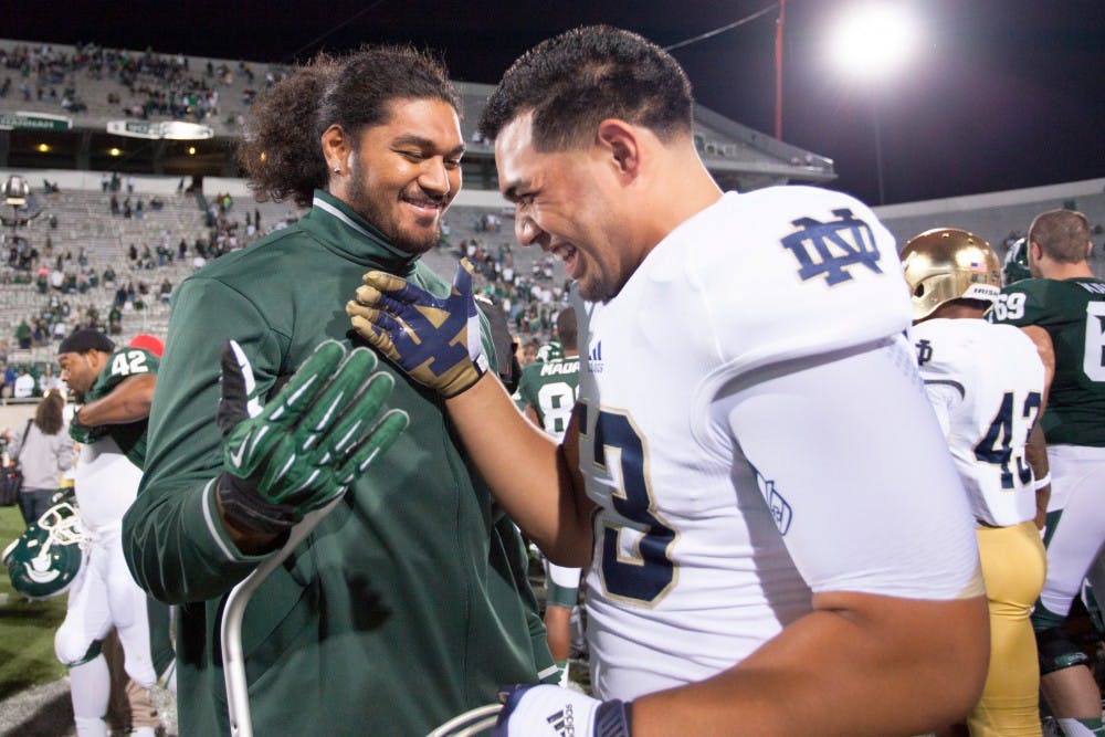 Senior offensive tackle Fou Fonoti greets Notre Dame junior defensive end Justin Utupo after the game on Saturday, Sept. 15, 2012. The Spartans lost to Notre Dame 20-3. Julia Nagy/The State News