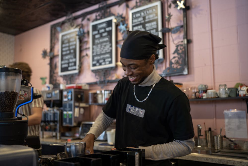 <p>Barista, Matthew Philips prepares a non-alcoholic cocktail from Blue Owl Coffee Co., located off Ann St. in East Lansing.&nbsp;</p>