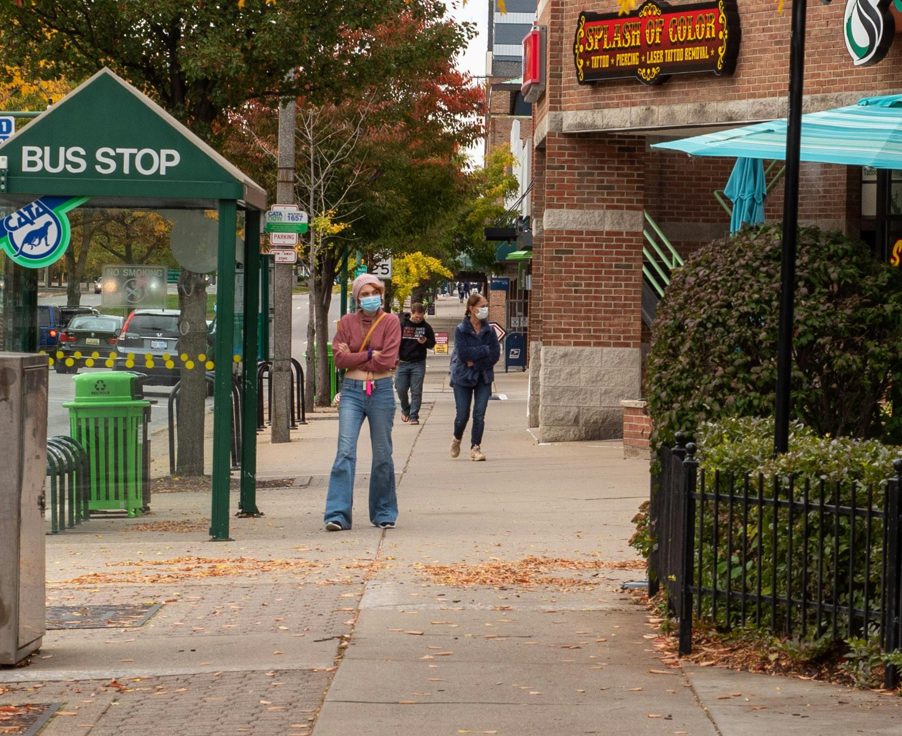 <p>Residents wearing masks in downtown East Lansing on Wednesday, Oct. 14, 2020.</p>