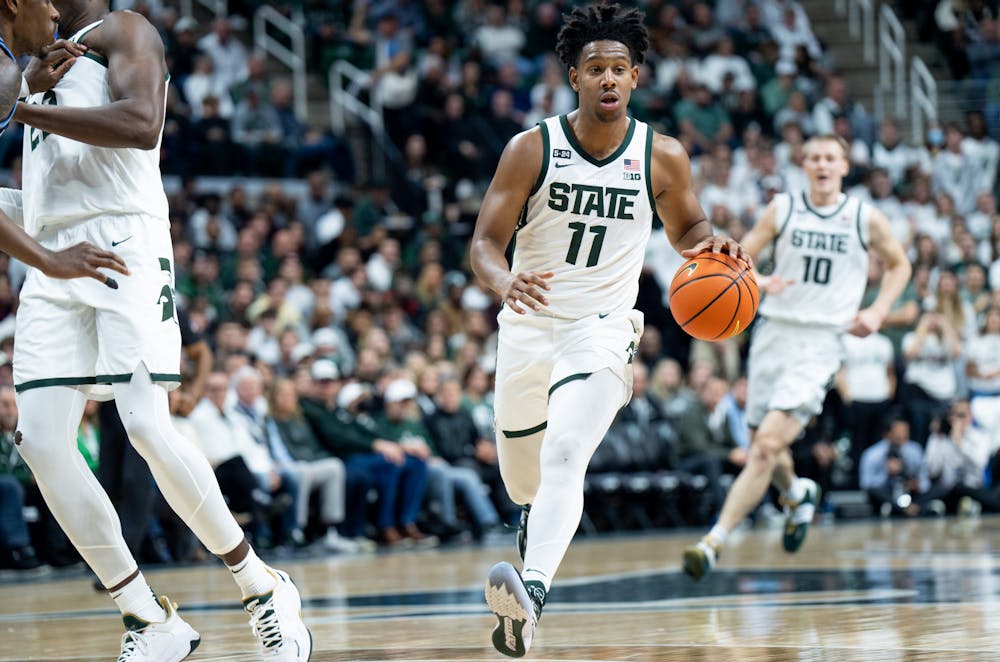 Junior guard A.J. Hoggard (11) dribbles the ball during a game against Villanova at the Breslin Center on Nov. 18, 2022. The Spartans defeated the Wildcats 73-71. 