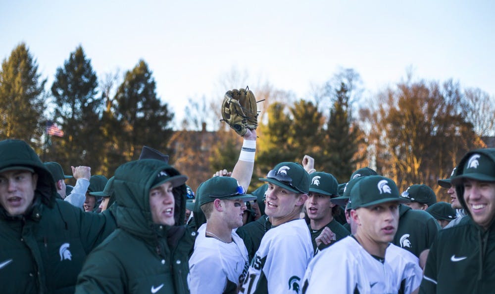 The Spartans huddle after the game against Central Michigan on March 21, 2017 at McLane Stadium at Kobs Field. The Spartans defeated the Chippewas, 11-2.
