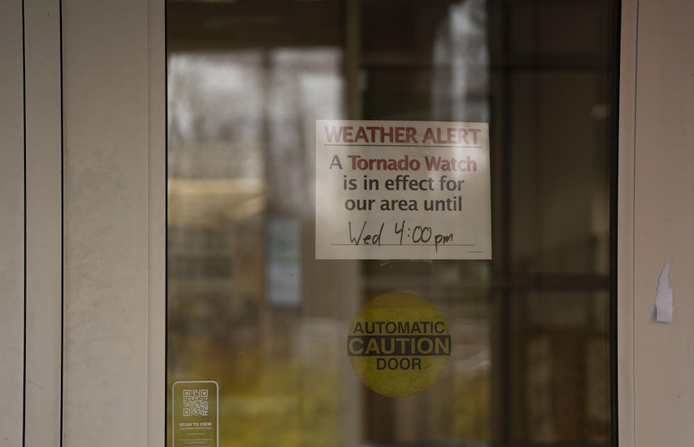 A tornado watch sign hangs in the library entrance on Wednesday, April 5, 2023 during a period of heavy rains and extreme weather.