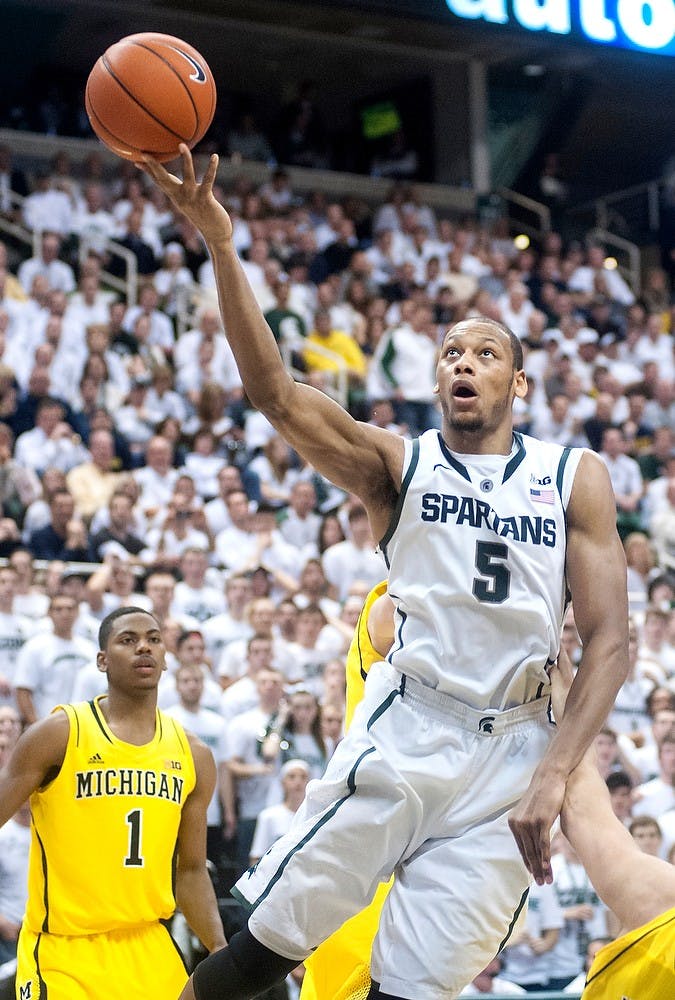 	<p>Junior center Adreian Payne goes to lay the ball up against Michigan. <span class="caps">MSU</span> defeated U-M, 75-52, Tuesday, Feb. 12, 2013, at Breslin Center. Justin Wan/The State News</p>