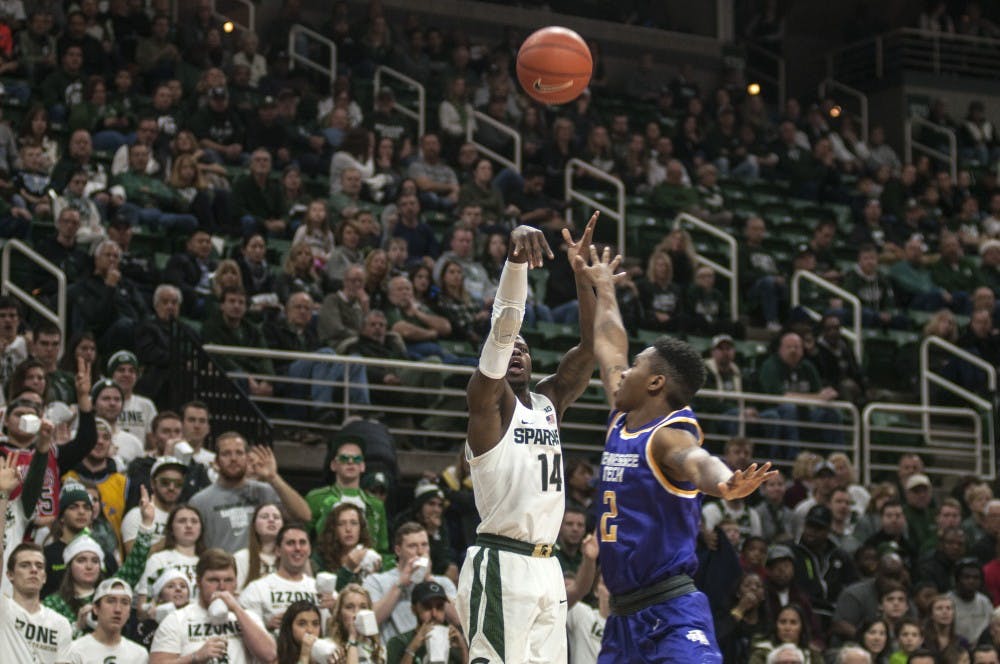 Senior guard Eron Harris (14) takes a jump-shot during the men's basketball game against Tennessee Tech on Dec. 10, 2016 at Breslin Center. 