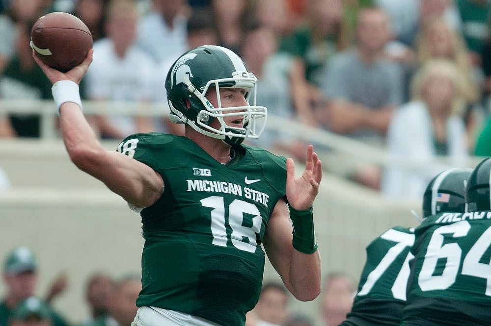 	<p>Sophomore quarterback Connor Cook throws the ball Sept. 7, 2013, at Spartan Stadium. The Spartans defeated the Bulls, 21-6. Julia Nagy/The State News</p>
