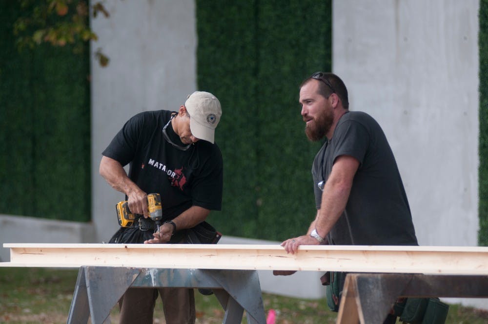 Construction workers prepare for the filming of Batman vs. Superman: Dawn of Justice on Oct. 13, 2014, at the Eli and Edythe Broad Art Museum. The film is scheduled to shoot in the next seven days, Oct. 13-21. Aerika Williams/The State News