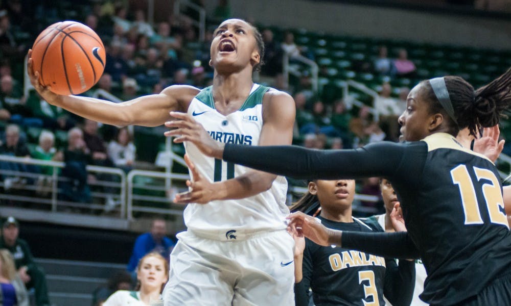 <p>Redshirt-sophomore Shay Colley (0) takes a shot on the net during the game against Oakland on Nov. 13, 2017, at Breslin Center. The Spartans defeated the Grizzlies 95-63.</p>