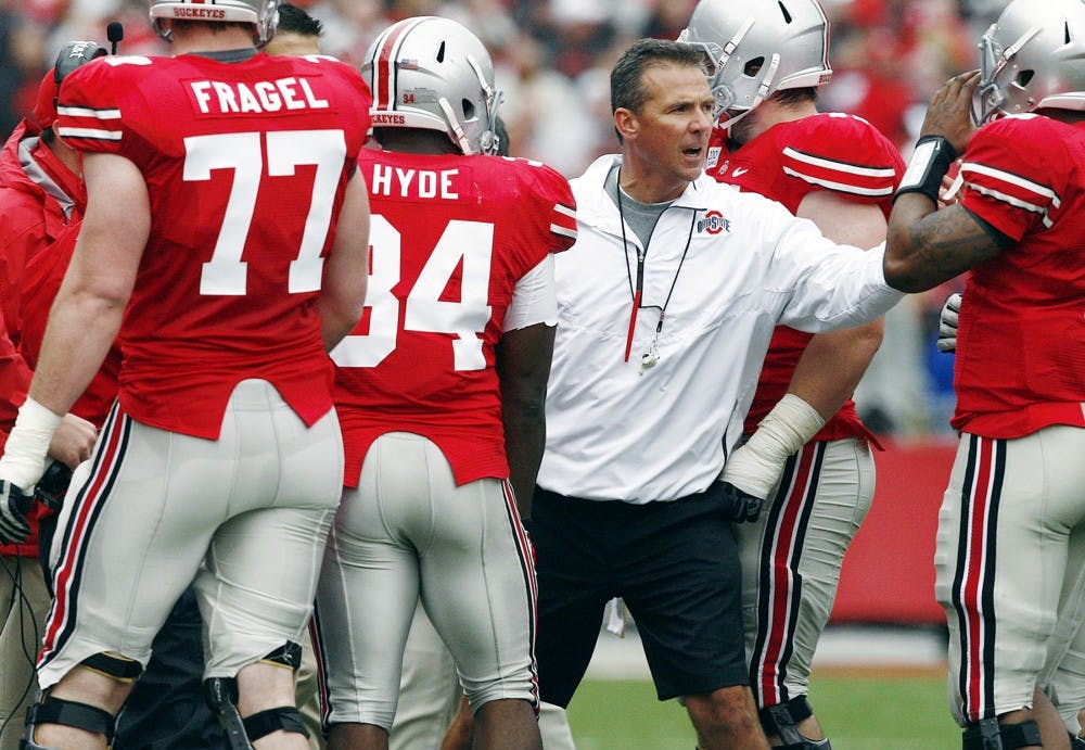 Ohio State head football coach Urban Meyer coaches the "Scarlet Team" during the Scarlet vs Grey spring game in Columbus, Ohio, Saturday, April 21, 2012. Brooke LaValley/Columbus Dispatch/MCT