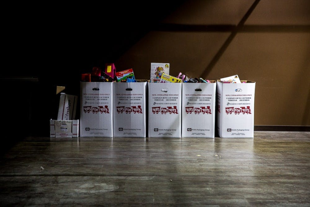 Toys in boxes for the Toys for Tots organization sit in an empty room during the annual Winter Glow Festival on Dec. 1, 2018 at the Marriott Hotel. The free festival featured carriage rides, music, a holiday farmers market and other seasonal activities.