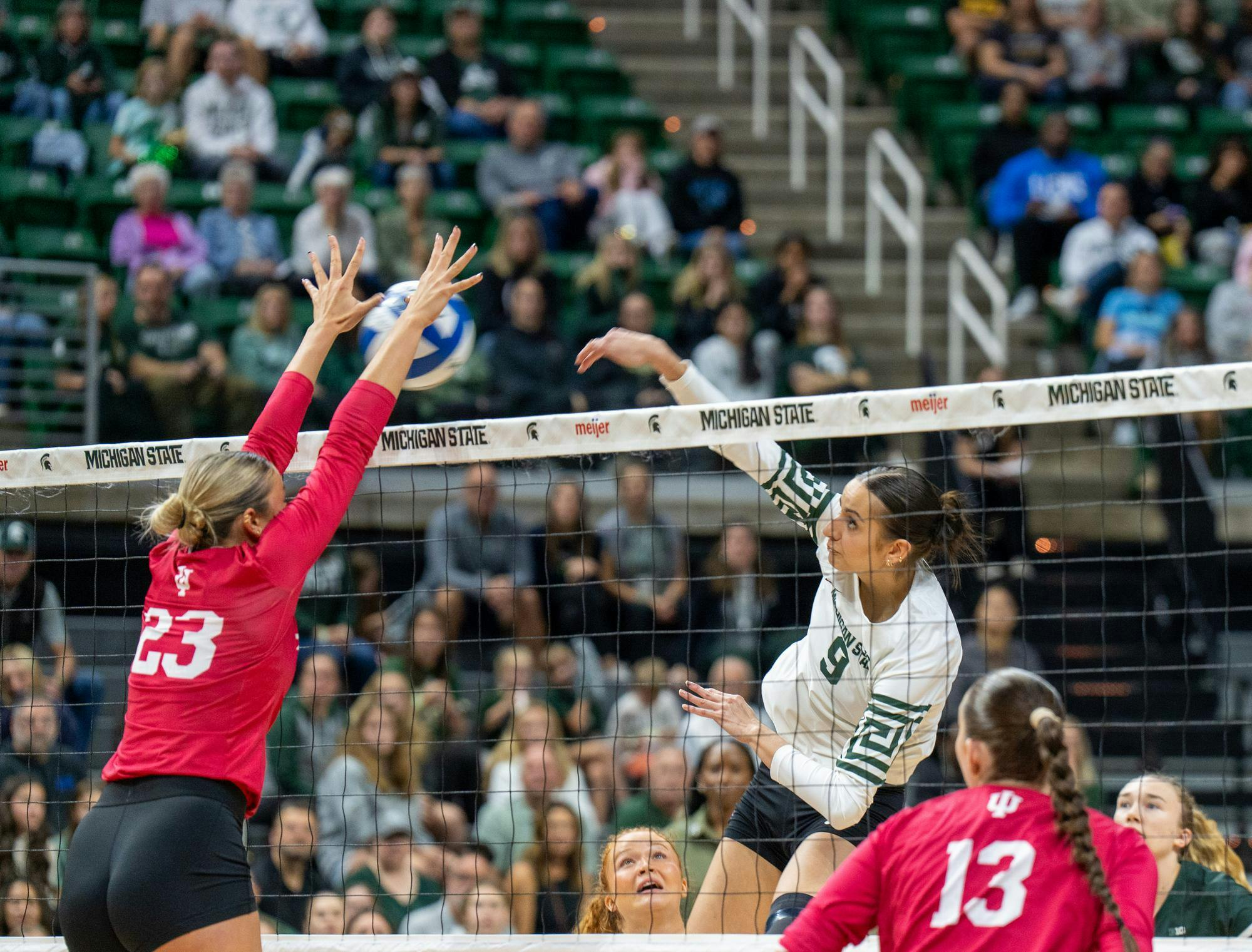 Junior middle blocker Zuzanna Kulig (9) spikes the ball during the matchup against Indiana University at the Breslin Center on Oct. 12, 2025.