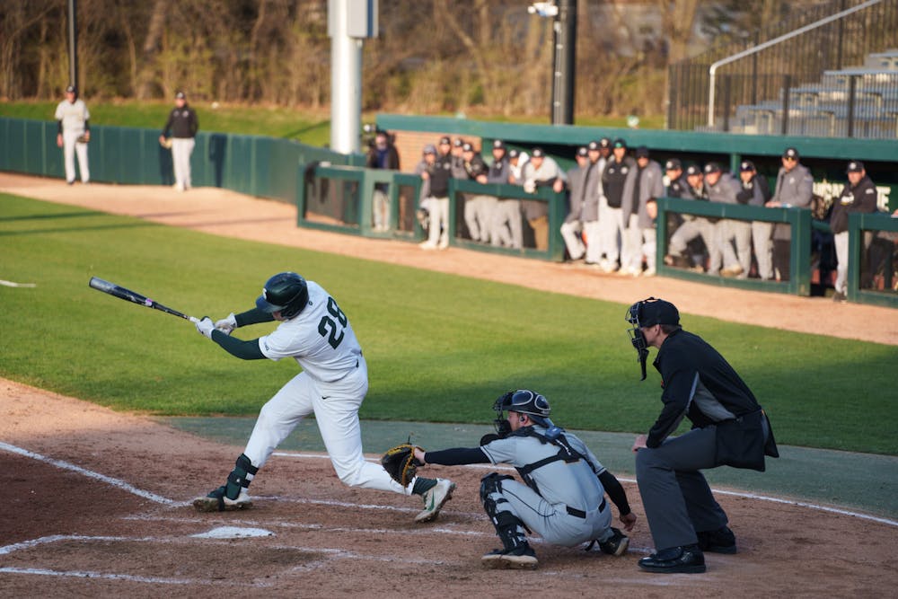 Michigan State sophomore infielder Brock Vradenburg (28) hits a single to the rightside allowing redshirt senior Peter Ahn (16) and junior Casey Mayes (33) to score runs in the bottom of the fourth. Michigan State won 7-4 against Purdue Fort Wayne at the McLane Stadium, on Apr. 27, 2022.