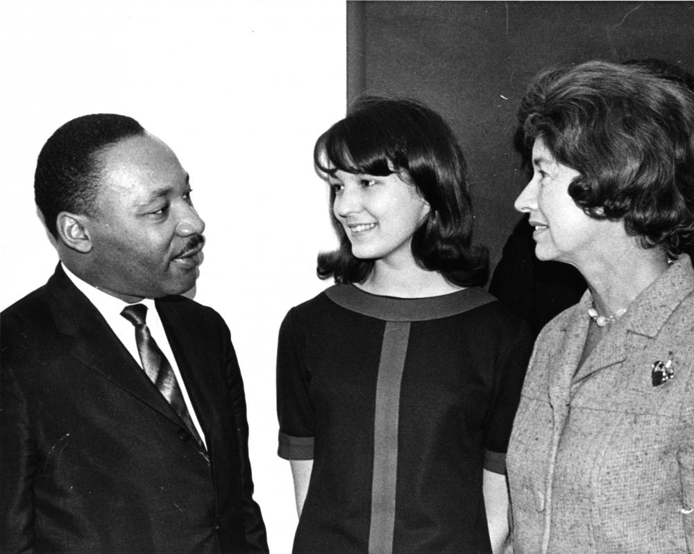 Martin Luther King Jr. speaks to graduate student Laura L. Leichliter (center) and Michigan's First Lady, Lenore Romney, on March 9, 1966. Photo courtesy of the MSU Archives