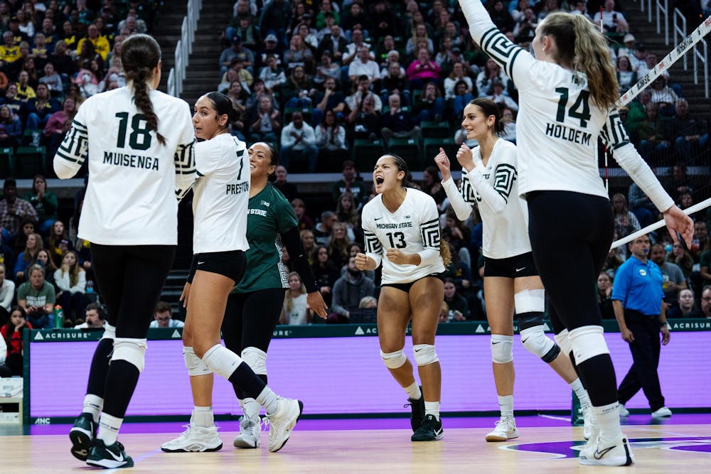 Michigan State celebrates a point against University of Michigan at the Breslin Center on Nov. 15, 2024.