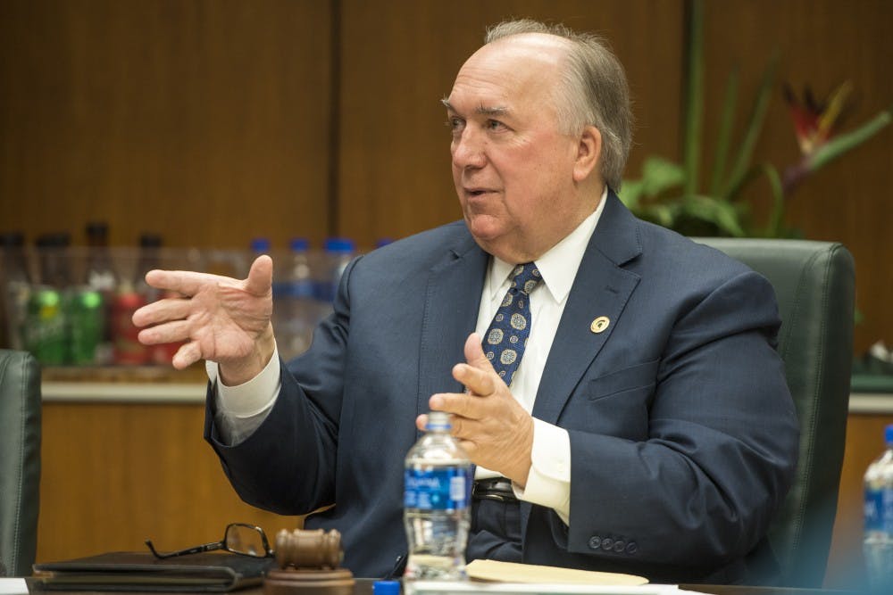 Interim President John Engler speaks during the Board of Trustees meeting on Feb. 16, 2018 at the Hannah Administration Building. (Nic Antaya | The State News)