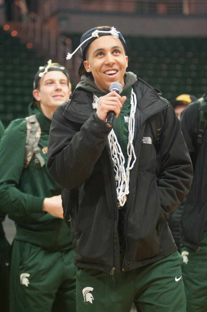 <p>Senior guard Travis Trice responds to the crowds, "MVP" chant March 29, 2015, at Breslin Center during the welcome home celebration of their win over Louisville. The win advanced the team to the Final Four in Indianapolis, Indiana. Kennedy Thatch/The State News</p>